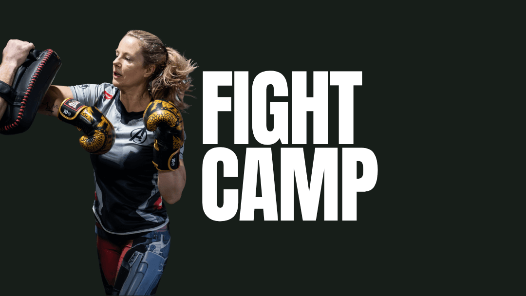 Woman practicing boxing with gloves and pads; text says 'Fight Camp'.